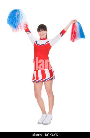 Heureux pom-pom pom girl holding sur fond blanc Banque D'Images