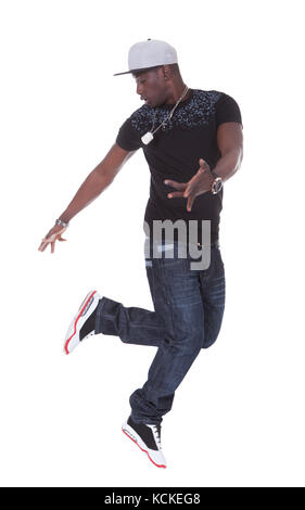 Portrait d'un jeune homme africain danser sur fond blanc Banque D'Images