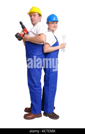 Soldat et femme militaire portant des casques bleus et de l'ensemble - man holding driller, woman holding spanner - isolated on white ba Banque D'Images