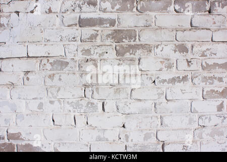 Arrière-plan en brique blanche. Rustique, vieux, peint la texture. Façade de la maison, une clôture, un mur de pierre Banque D'Images