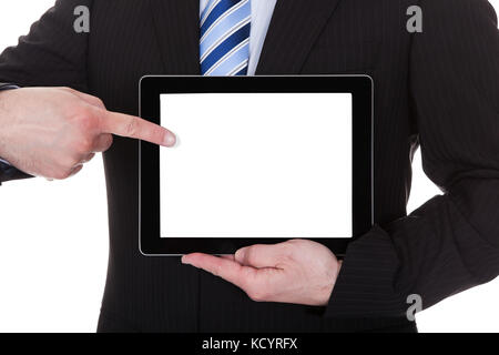 Mature businessman showing digital tablet over white background Banque D'Images