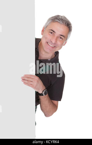 Mâle mature Gardner Holding Placard sur fond blanc Banque D'Images