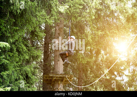 Teenage girl on zip wire Banque D'Images