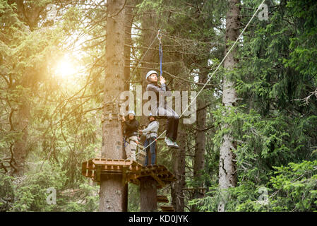 Teenage girl on zip wire Banque D'Images