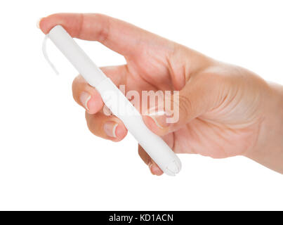 Close-up of hand holding tampon sur fond blanc Banque D'Images