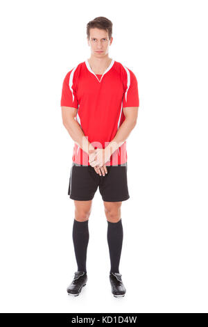 Portrait de l'homme joueur de football en maillot rouge Banque D'Images