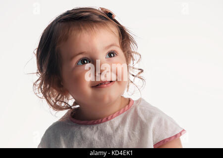 Belle blonde baby girl portrait on white background, studio shot Banque D'Images