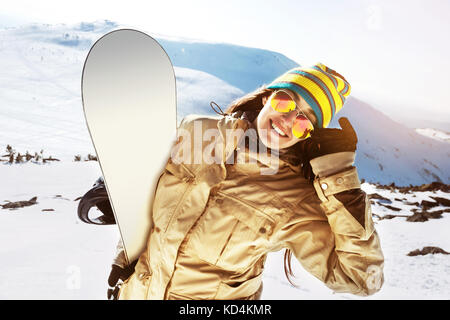 Happy girl snowboarder snowboard ski ski concept Banque D'Images