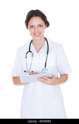 Portrait Of Happy Female Doctor Holding Digital Tablet Over White Background Banque D'Images