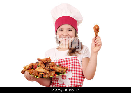 Happy little girl cook avec pilons de poulet Banque D'Images