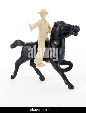 Jouet en plastique, pistolet de cowboy sur cheval noir. Banque D'Images