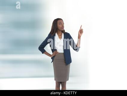 Digital composite of Businesswoman pointing up Banque D'Images