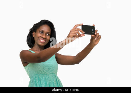 Woman taking selfies Banque D'Images