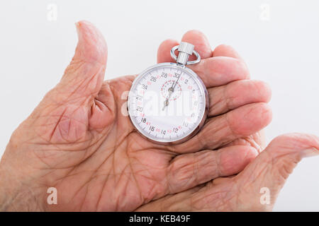 Close-up of Businesswoman Holding Chronomètre à la main Banque D'Images