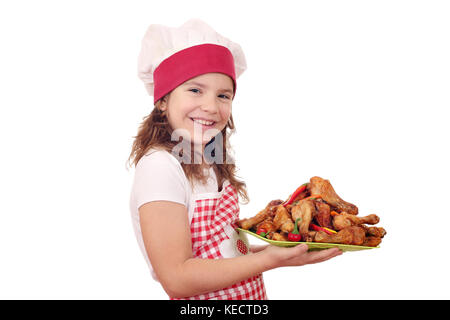 Happy little girl avec pilons de poulet rôti cook Banque D'Images