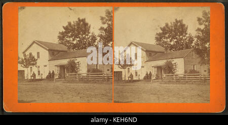 Couple assis devant leur maison, Waterloo, Iowa, par Hickox & Co. Banque D'Images