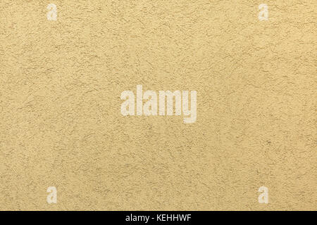 Mur en stuc peint jaune. La texture de fond. Banque D'Images