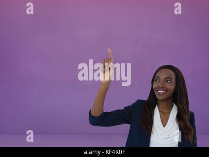 Digital composite of Businesswoman touching air de fond violet Banque D'Images