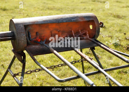 Usa, Wyoming, du cantonnement de marque des fers à repasser, chauffage dans le feu, Big Creek Ranch Banque D'Images