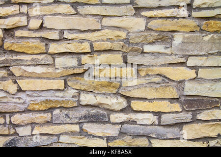 Mur de pierre artisanal de décoration pour l'arrière-plan. Banque D'Images