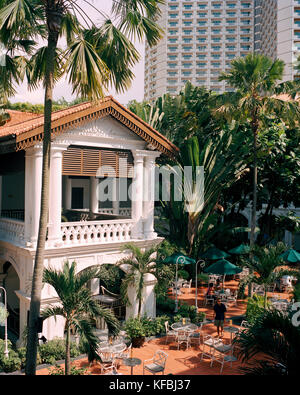 Singapour, l'Asie, de l'hôtel Raffles jardin intérieur. Banque D'Images