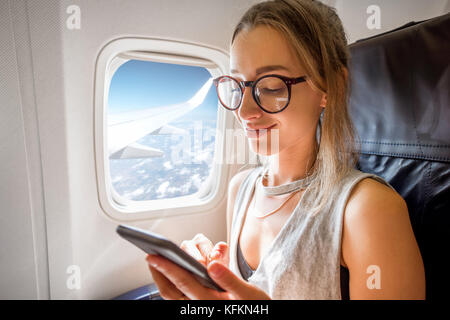 Femme dans l'avion Banque D'Images