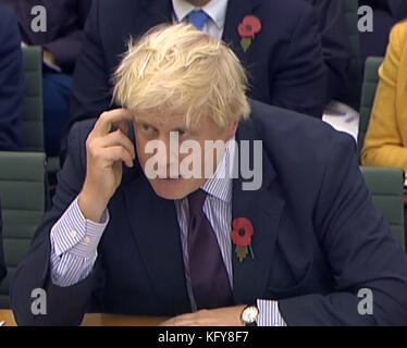 Le secrétaire aux Affaires étrangères Boris Johnson présente des témoignages au Comité des Affaires étrangères de la Chambre des communes à Portcullis, à Londres. Banque D'Images