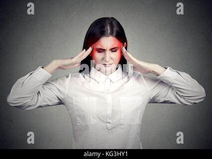 Souligné femme triste avec maux de tête Banque D'Images