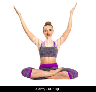 Les femmes qui ne le yoga effectuer assis en lotus poser sur le sol avec plusieurs mains. Banque D'Images