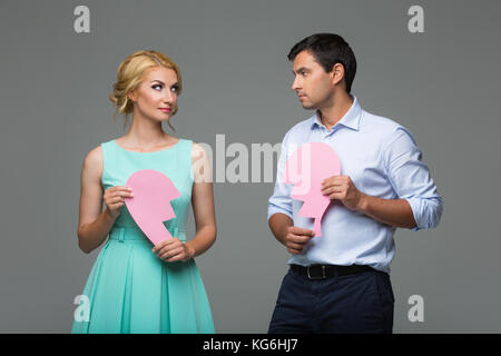 Beautiful couple holding broken heart rose Banque D'Images