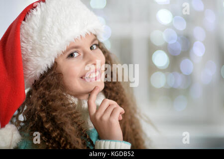 Little girl in santa hat Banque D'Images