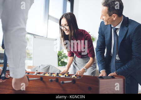 Woman playing table football Banque D'Images