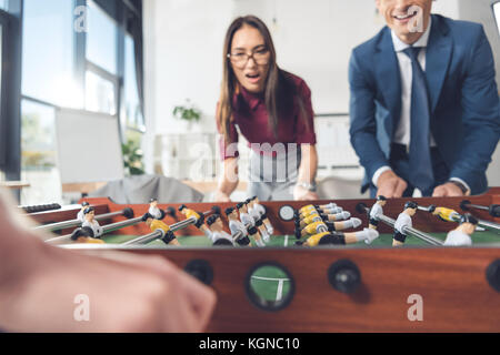 Woman playing table football Banque D'Images