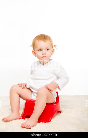 Baby sitting sur pottie Banque D'Images