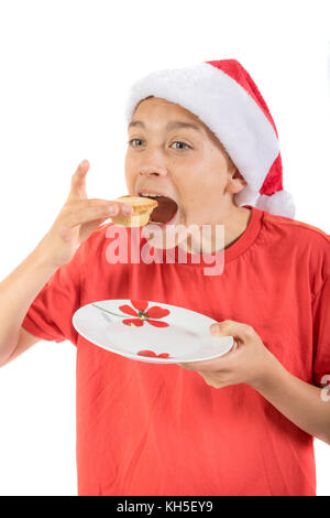 Teenage boy sur le point de manger un mince pie Banque D'Images