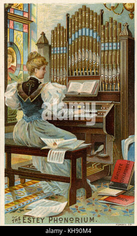 L'Estey Phonorium - illustration. Harmonium joué par une jeune femme en robe de style édouardien. Orgue fabriqué par l'Estey Organ Company, New York, USA. Banque D'Images