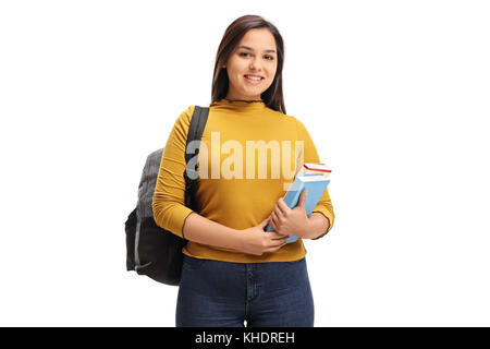 Étudiant de l'adolescence féminine avec un sac à dos et books smiling isolé sur fond blanc Banque D'Images