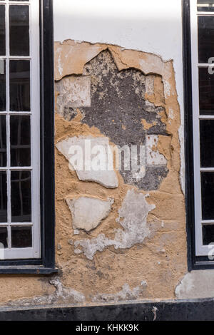 Mur extérieur avec peu de rendu endommagé Norfolk Angleterre Walsingham Banque D'Images