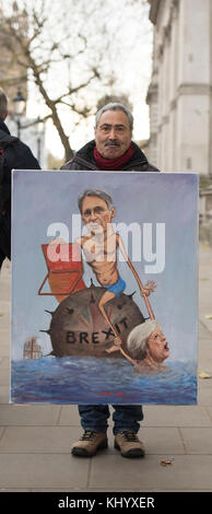 Downing Street, Londres, Royaume-Uni. 22 novembre 2017. L'artiste politique Kaya Mar avec un tableau du Brexit à Whitehall en tant que chancelier de l'Échiquier Philip Hammond quitte 11 Downing Street pour présenter son budget d'automne au Parlement. Crédit : Malcolm Park/Alay Live News. Banque D'Images