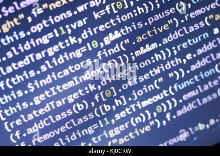 Minificated rougeoyant du code javascript. Résumé de l'écran. développeur web moderne hacking réseau informatique. Banque D'Images