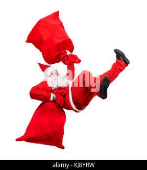 Funny santa claus falls avec un sac rempli de cadeaux. x-mas santa claus se précipiter donner des cadeaux à Noël. tomber santa transporter sac avec boîte-cadeau. Banque D'Images