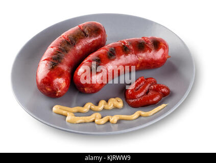 Saucisses couché sur plaque gris avec de la moutarde et du ketchup. isolé sur fond blanc. Le concept d'aliments traditionnels. Banque D'Images