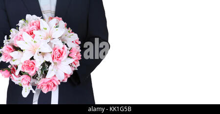 Business man holding a bouquet of pink roses Banque D'Images