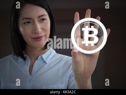 Digital composite of Businesswoman touching icône graphique bitcoin Banque D'Images