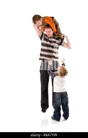 Heureux Père jouant avec deux fils isolated on white Banque D'Images