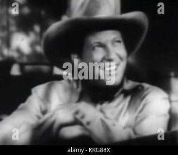 Cette image est une photo recadrée de la bande-annonce de *Cowboy de Brooklyn*, avec Johnnie Davis. Le film est une comédie de 1938 sur un homme qui voyage dans l'Ouest américain, avec Davis dans le rôle principal. Banque D'Images