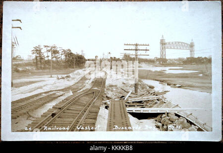 This postcard depicts Cape Cod's Main Line after the 1938 hurricane, showing the devastation and recovery efforts that followed one of the most significant storms in the region's history. Banque D'Images