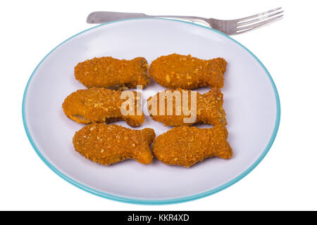 L'alimentation des enfants des poissons nuggets. Banque D'Images