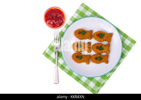 L'alimentation des enfants des poissons nuggets. Banque D'Images