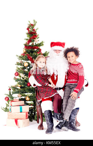 Les enfants avec le Père Noël Banque D'Images